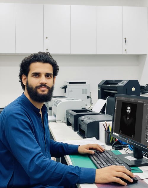 tahseen qamar, man working on computer shop